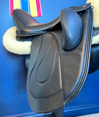 17" WOW Pinnacle Dressage Saddle Semi-Curved Tree black panel leather butt wear strip high thigh high profile blocks. Buy demo stock, order new, or rent weekly, only at Delfina Saddlery.