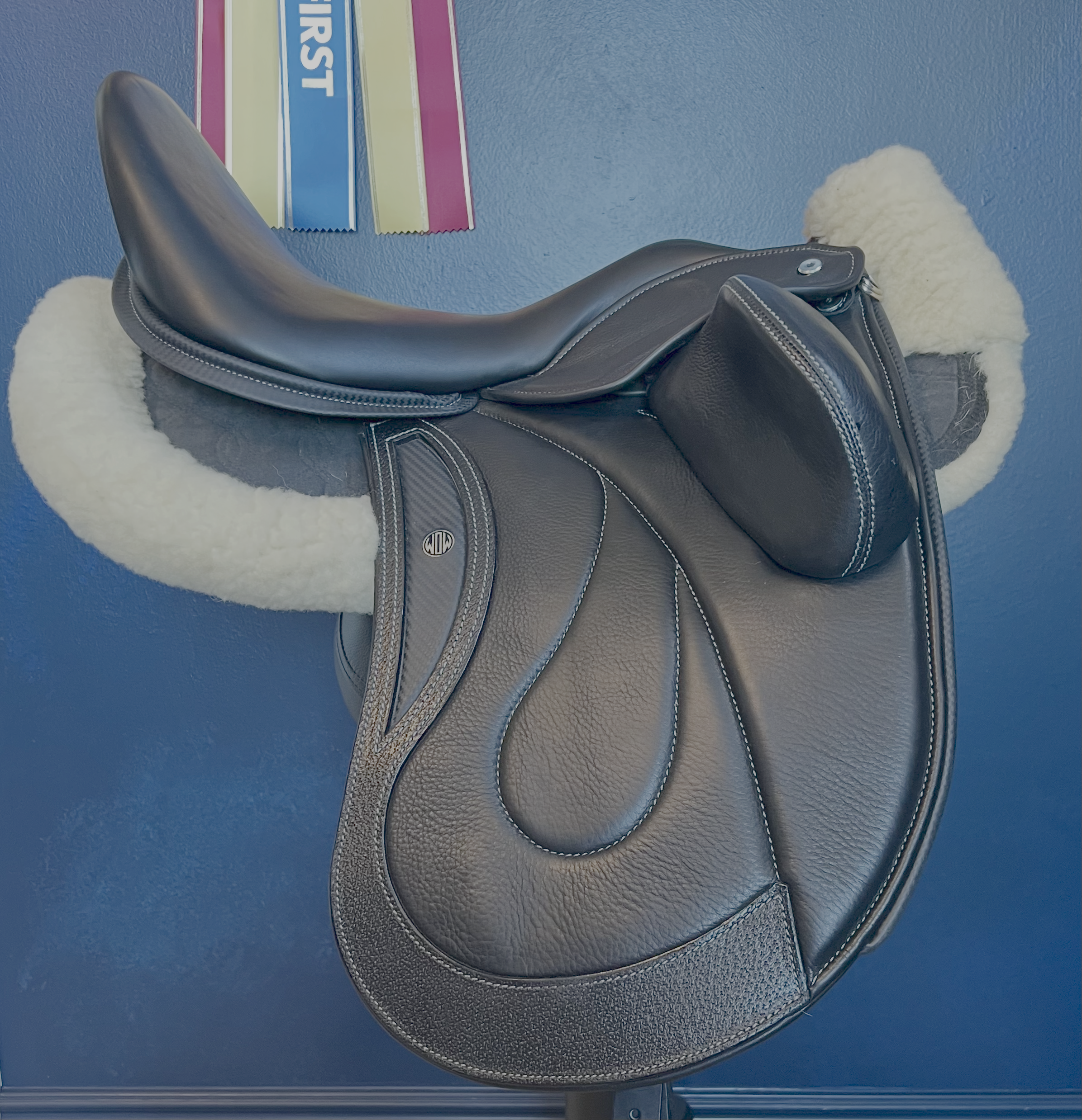 17" DMK Pinnacle Dressage Saddle with carbon fiber flap inlay & cantle infill, and carbon fiber seat facings. Curved Tree. High thigh, high profile blocks. Rent, Buy Demo, or Purchase New at Delfina Saddlery