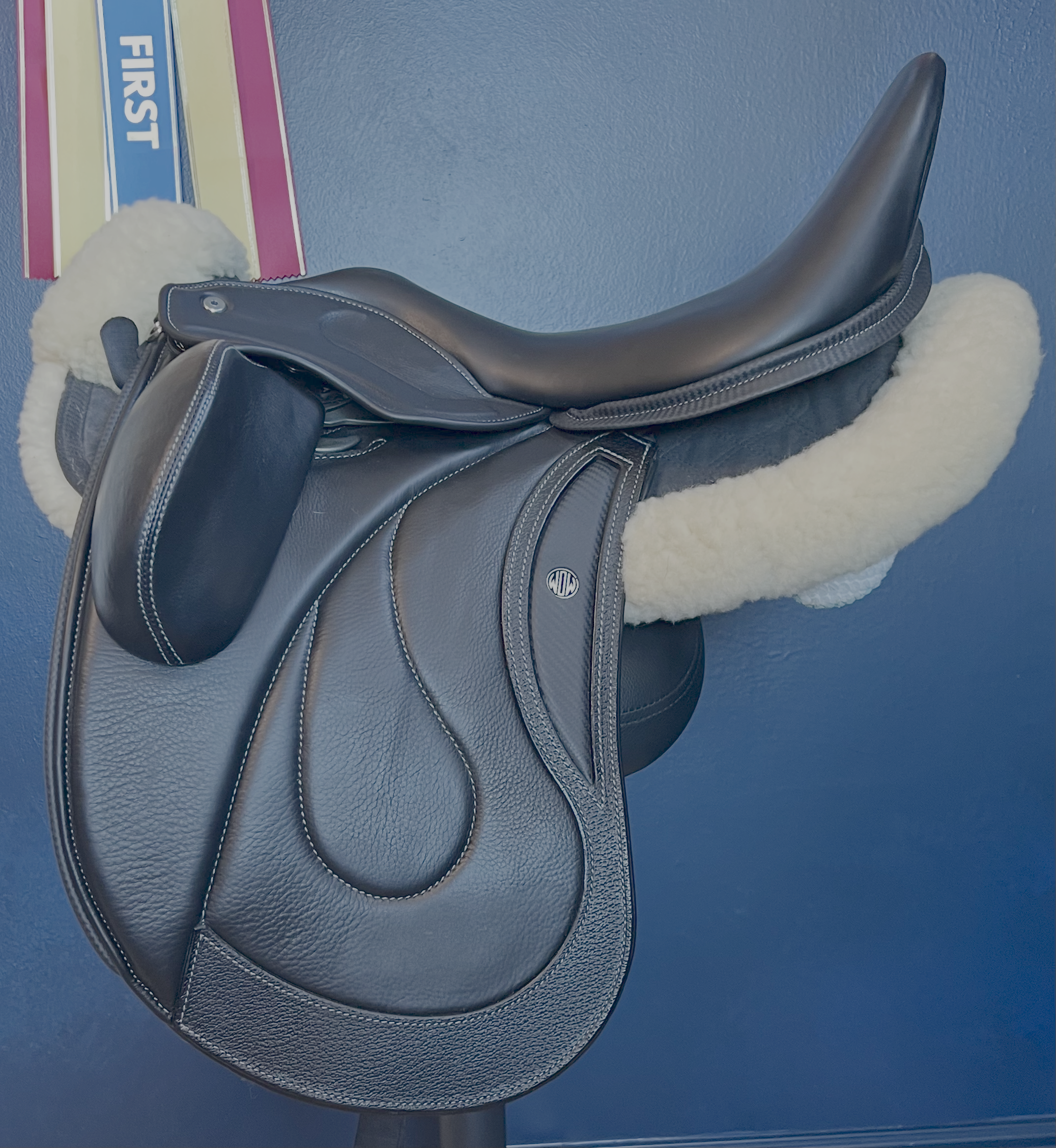 17" DMK Pinnacle Dressage Saddle with carbon fiber flap inlay & cantle infill, and carbon fiber seat facings. Curved Tree. High thigh, high profile blocks. Rent, Buy Demo, or Purchase New at Delfina Saddlery