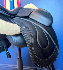 17" DMK Pinnacle Dressage Saddle with carbon fiber flap inlay & cantle infill, and carbon fiber seat facings. Curved Tree. High thigh, high profile blocks. Rent, Buy Demo, or Purchase New at Delfina Saddlery