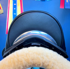 17" DMK Pinnacle Dressage Saddle with carbon fiber flap inlay & cantle infill, and carbon fiber seat facings. Curved Tree. High thigh, high profile blocks. Rent, Buy Demo, or Purchase New at Delfina Saddlery