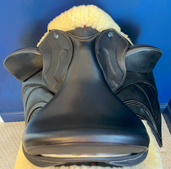 17" DMK Pinnacle Dressage Saddle with carbon fiber flap inlay & cantle infill, and carbon fiber seat facings. Curved Tree. High thigh, high profile blocks. Rent, Buy Demo, or Purchase New at Delfina Saddlery