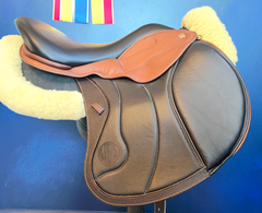 17" DMK Peak Show Jumping Saddle. Semi-curved Tree. Forward Cut flap. Fixed hi-wedge block. Rent, Buy Demo, or Purchase New only at Delfina Saddlery.