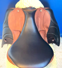 17" DMK Peak Show Jumping Saddle. Semi-curved Tree. Forward Cut flap. Fixed hi-wedge block. Rent, Buy Demo, or Purchase New only at Delfina Saddlery.