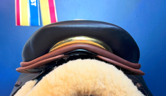 17" DMK Peak Show Jumping Saddle. Semi-curved Tree. Forward Cut flap. Fixed hi-wedge block. Rent, Buy Demo, or Purchase New only at Delfina Saddlery.