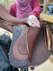 Movable-Block Dressage Saddle from WOW, showing movable-block and velcro area between flaps