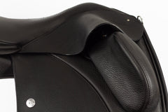 A close-up of the Duskin Dressage Saddle's adjustable fixed thigh block
