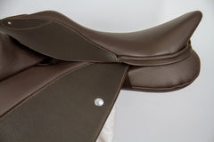 A close-up view of the Duskin Show Jumping Saddle with adjustable fixed block flap and double-foam panels
