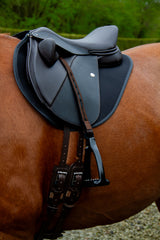 Duskin Show Jumping Saddle with adjustable fixed block flap on a chestnut horse