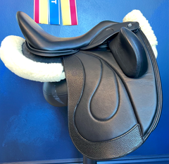 17" WOW Pinnacle Dressage Saddle Semi-Curved Tree black panel leather butt wear strip high thigh high profile blocks. Buy demo stock, order new, or rent weekly, only at Delfina Saddlery.