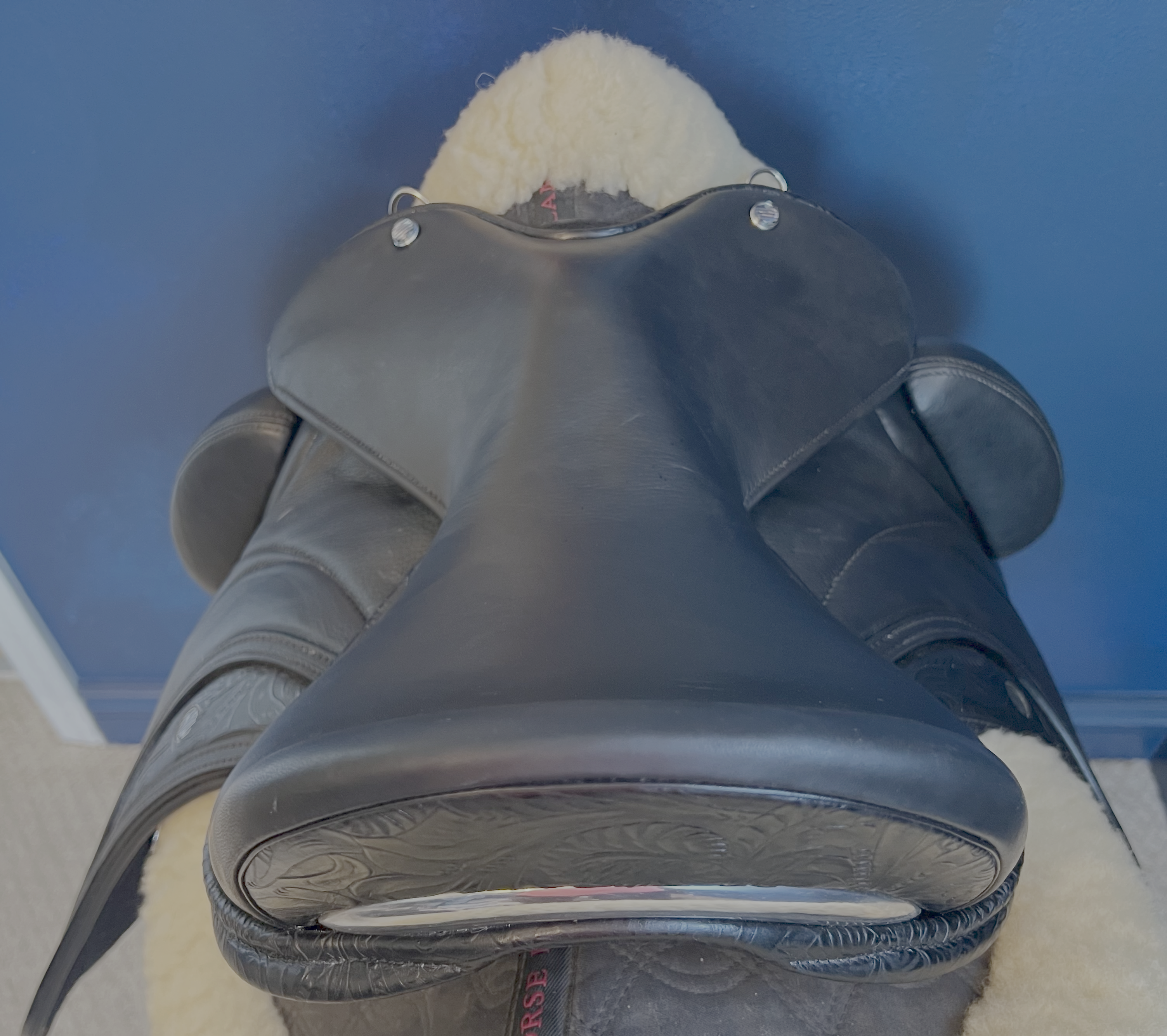 17" Custom Equitana Dressage Saddle with floral stamped leather infills, cantle, and facings. Semi-Curved Tree. Low thigh, Low profile blocks. Rent, Buy Demo, or Purchase New only at Delfina Saddlery.