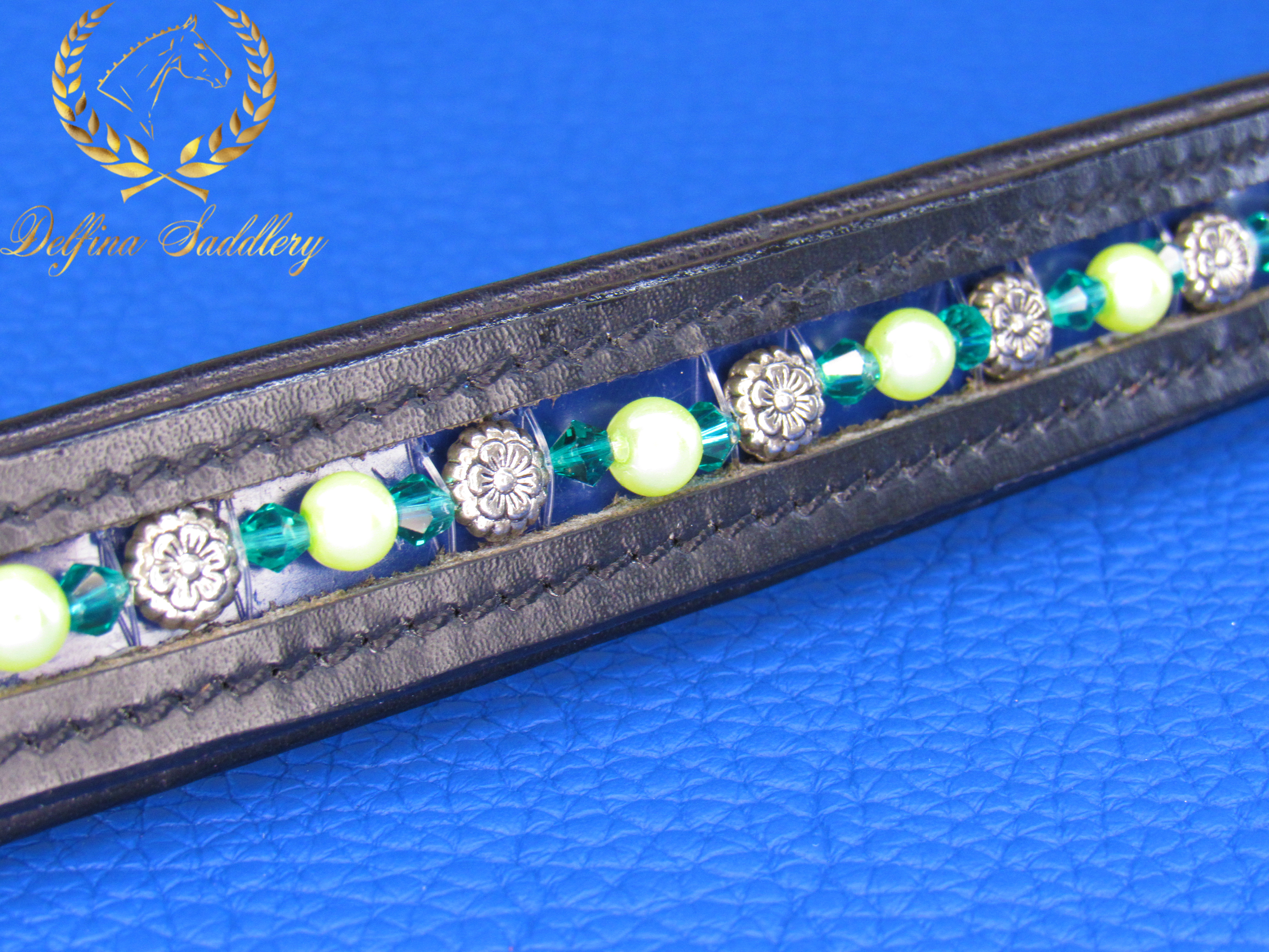 Green swarovski crystal rondelles with silver flower beads and round citron beads on a custom horse browband for english bridle straight style